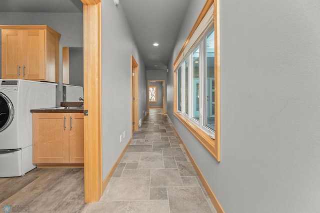1336 Goldenwood Dr, West Fargo, ND 58078 - corridor featuring baseboards, recessed lighting, light stone finish floors, and washer / dryer