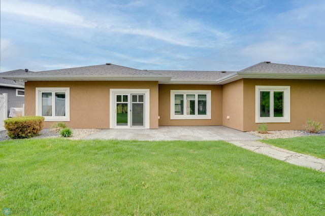 1336 Goldenwood Dr, West Fargo, ND 58078 - back of property with stucco siding, a yard, and a patio area