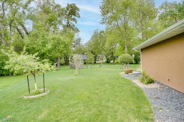 1336 Goldenwood Dr, West Fargo, ND 58078 - view of grassy yard featuring an outbuilding and view of scattered trees