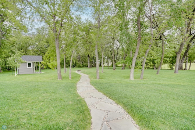 1336 Goldenwood Dr, West Fargo, ND 58078 - view of green lawn featuring an outdoor structure and view of scattered trees