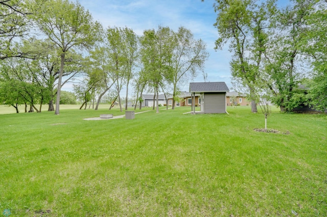 1336 Goldenwood Dr, West Fargo, ND 58078 - view of grassy yard with an outbuilding