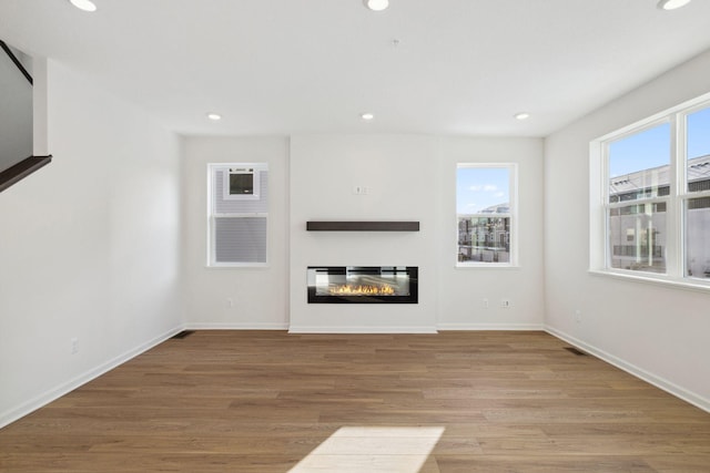 unfurnished living room with light wood-type flooring