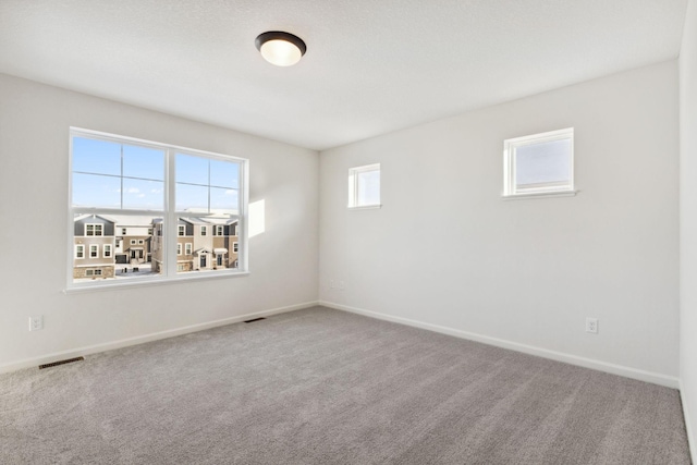 view of carpeted spare room