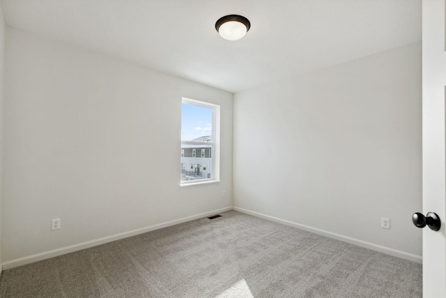 unfurnished room featuring carpet