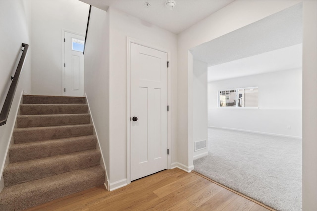 stairway with wood-type flooring