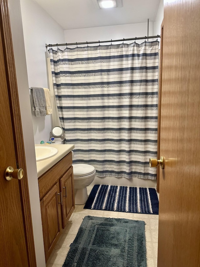 bathroom with toilet and vanity