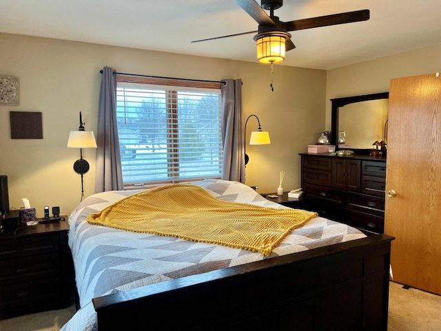 carpeted bedroom with ceiling fan