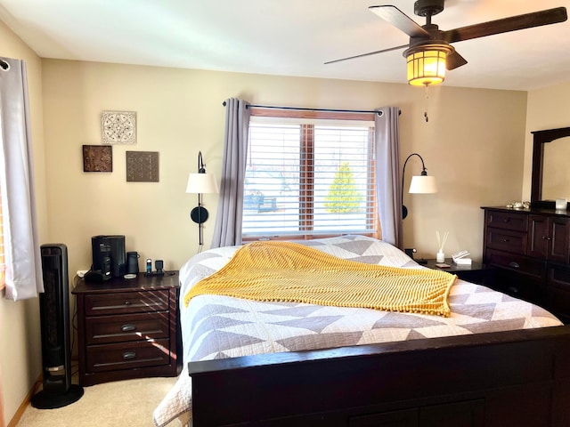 bedroom with carpet floors and a ceiling fan