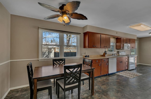 kitchen with sink, white appliances, and ceiling fan