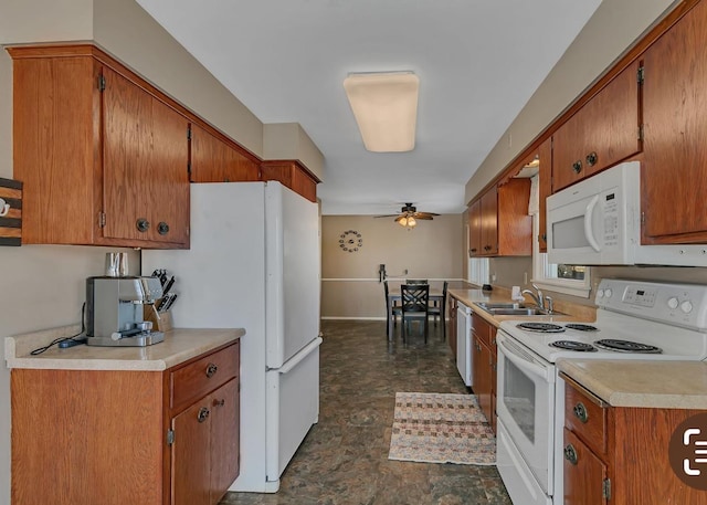 kitchen with sink, white appliances, and ceiling fan