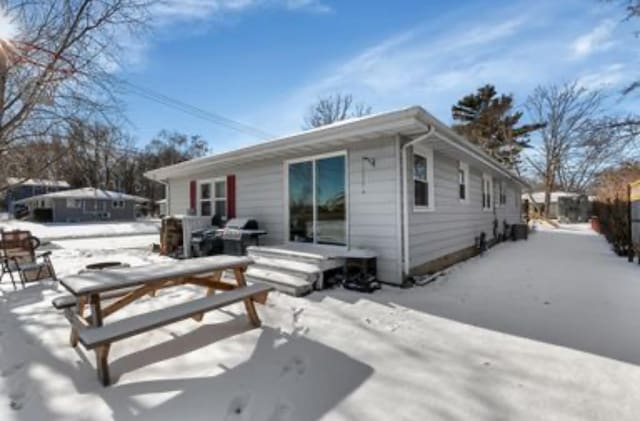 view of snow covered house