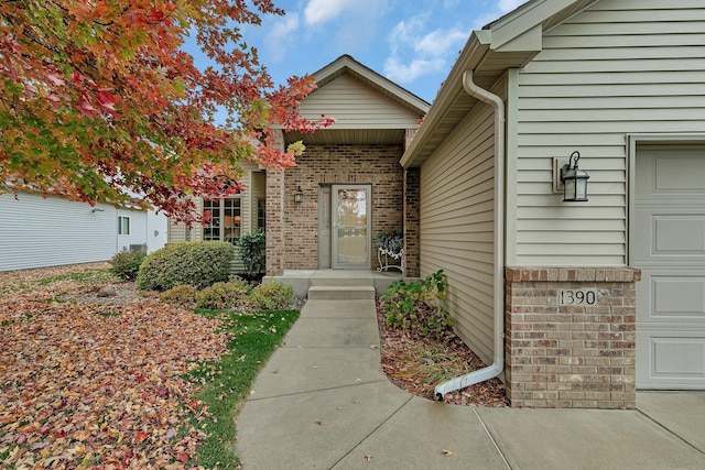 view of exterior entry featuring a garage