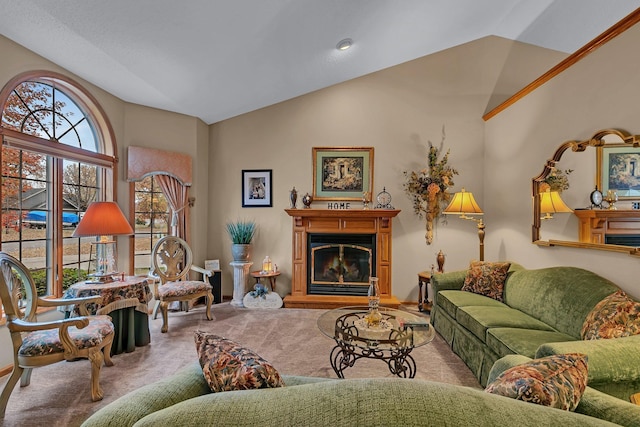 carpeted living room with lofted ceiling