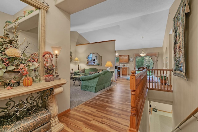 interior space with lofted ceiling and hardwood / wood-style flooring