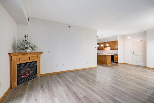 unfurnished living room with light wood-type flooring