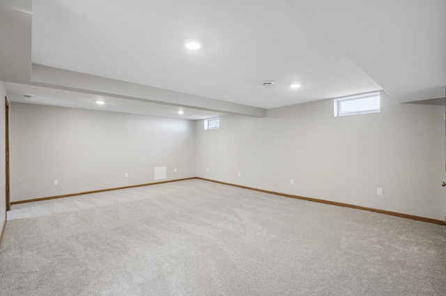 basement with visible vents, recessed lighting, carpet, and baseboards