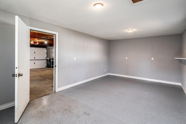 spare room featuring baseboards