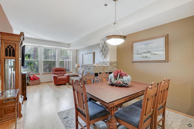 dining area with light hardwood / wood-style flooring