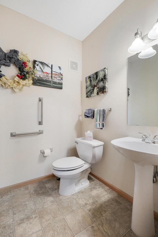 bathroom featuring toilet