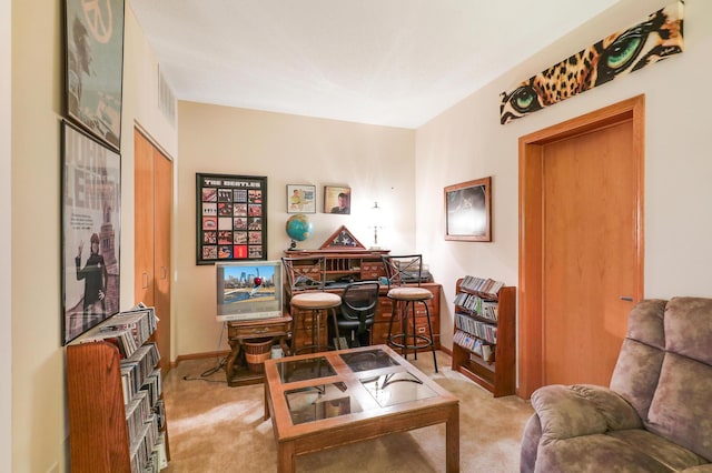 living area featuring light colored carpet