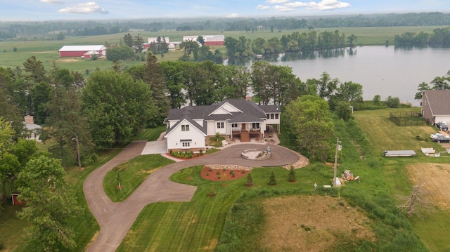 birds eye view of property with a water view