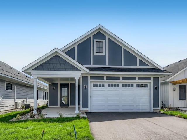 view of front of property with a porch and central AC unit