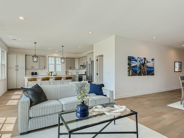 living room featuring light hardwood / wood-style floors and plenty of natural light