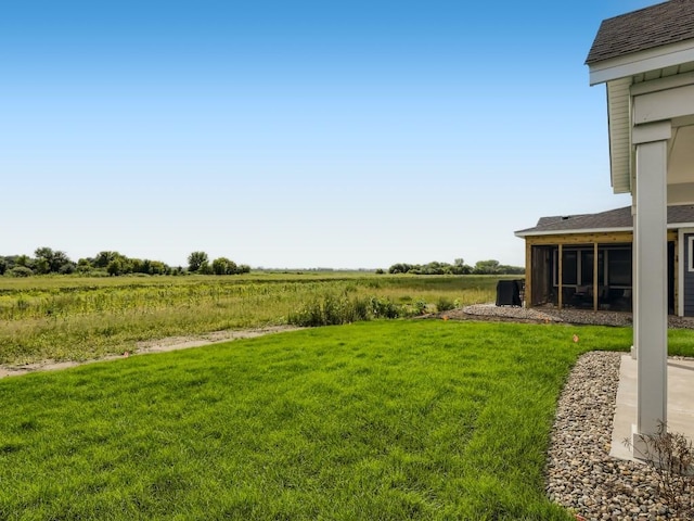 view of yard with a rural view