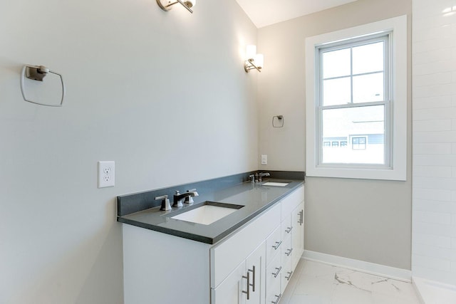 bathroom featuring plenty of natural light and vanity