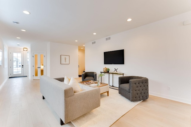 living room with light hardwood / wood-style floors