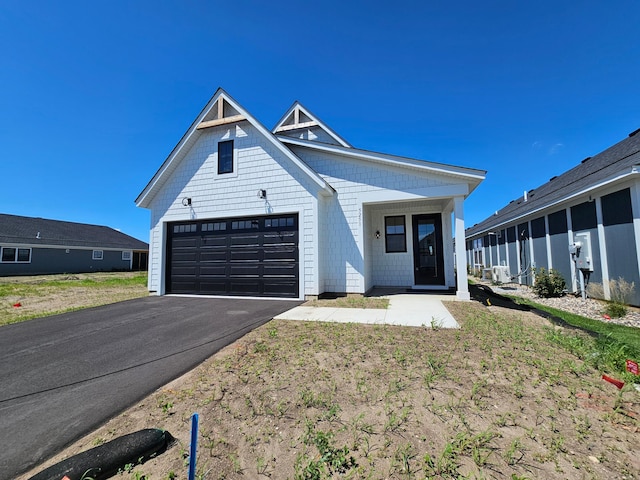 modern farmhouse style home with a garage