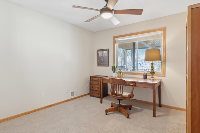 carpeted office with ceiling fan