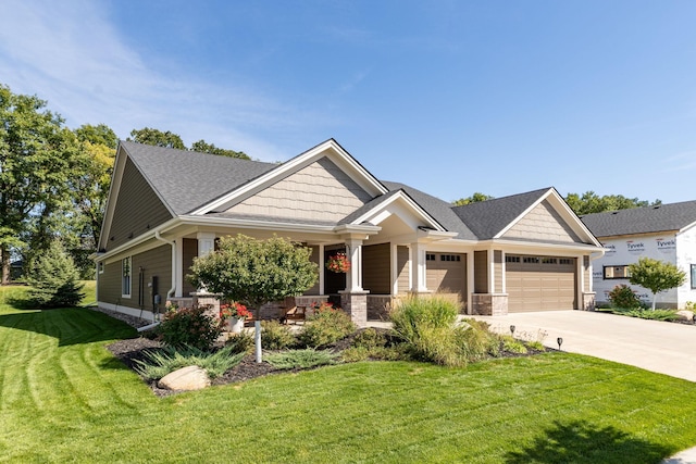 craftsman inspired home featuring a front lawn and covered porch