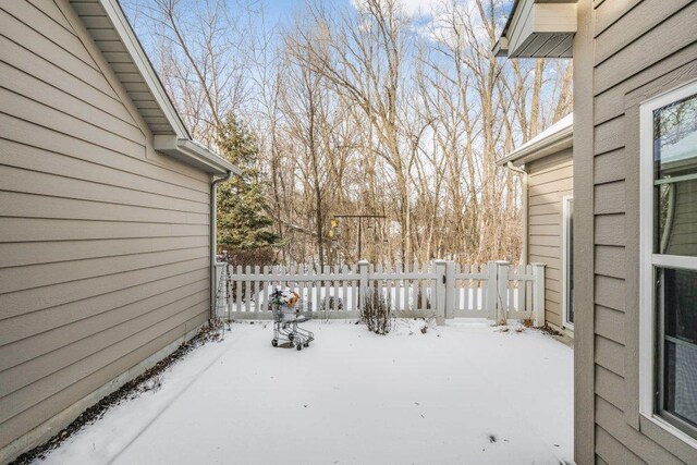 view of yard layered in snow