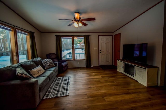 living room with lofted ceiling, dark hardwood / wood-style flooring, and ceiling fan