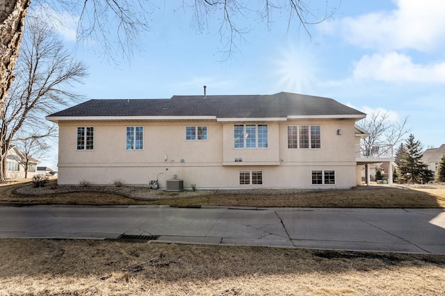 view of home's exterior with central AC unit and stucco siding