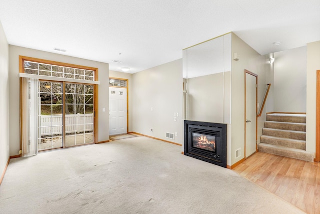 unfurnished living room with carpet floors