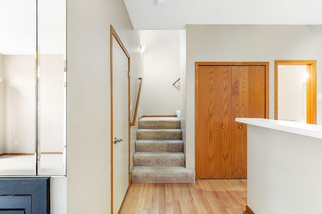 stairway featuring hardwood / wood-style flooring