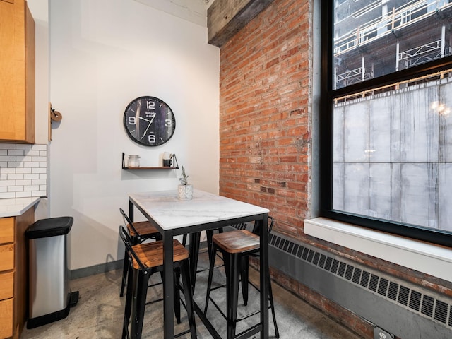 dining area featuring radiator heating unit