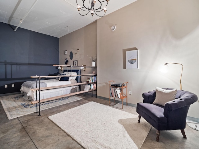 bedroom featuring an inviting chandelier and concrete flooring