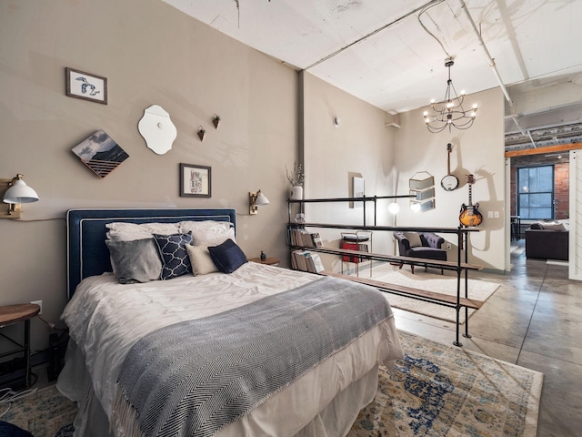 bedroom with concrete floors and a chandelier