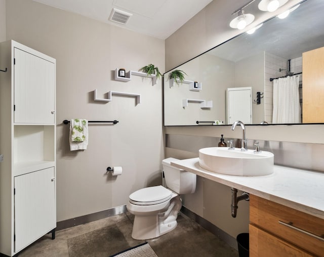 bathroom featuring toilet, concrete floors, a shower with curtain, and sink