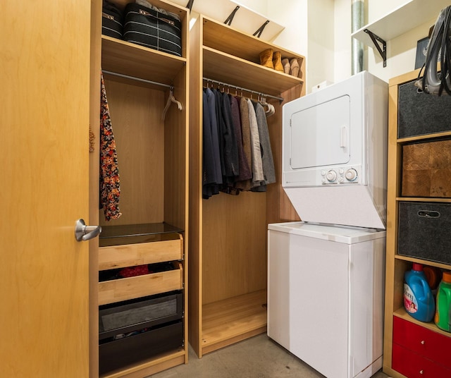 washroom featuring stacked washer / dryer