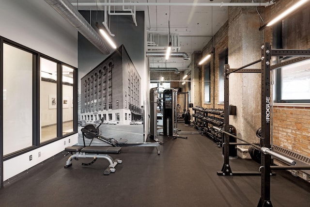 workout area with a towering ceiling