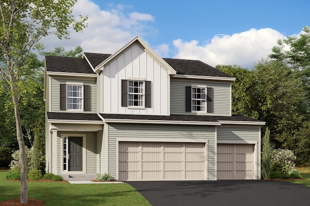 view of front of house featuring a garage and a front lawn