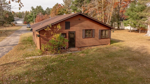 view of side of home featuring a yard