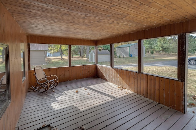 unfurnished sunroom featuring wooden ceiling