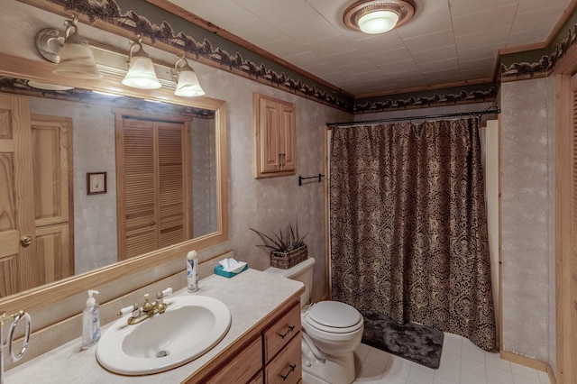 bathroom featuring toilet, vanity, and walk in shower