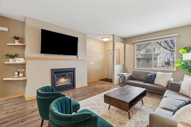 living room featuring a textured ceiling and hardwood / wood-style flooring