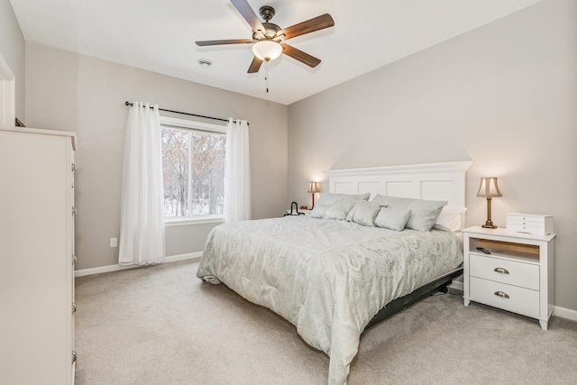 bedroom with light colored carpet and ceiling fan